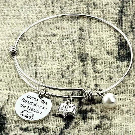 Bracelet that says: Drink tea, read books, be happy.