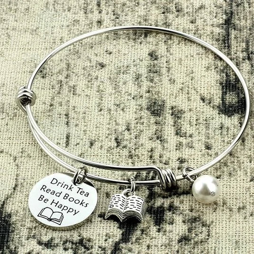 Bracelet that says: Drink tea, read books, be happy.